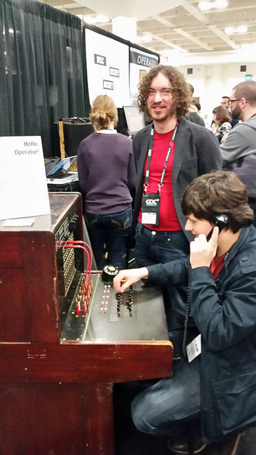 Mike Lazer-Walker (standing) created Hello, Operator at the Playful Systems Group at MIT. Players must emulate the actions of Ma Bell’s telephone switchboard operators by plugging wires into their proper connections upon request. 