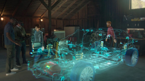 engineers using Microsoft Mesh to view a holographic model of a car